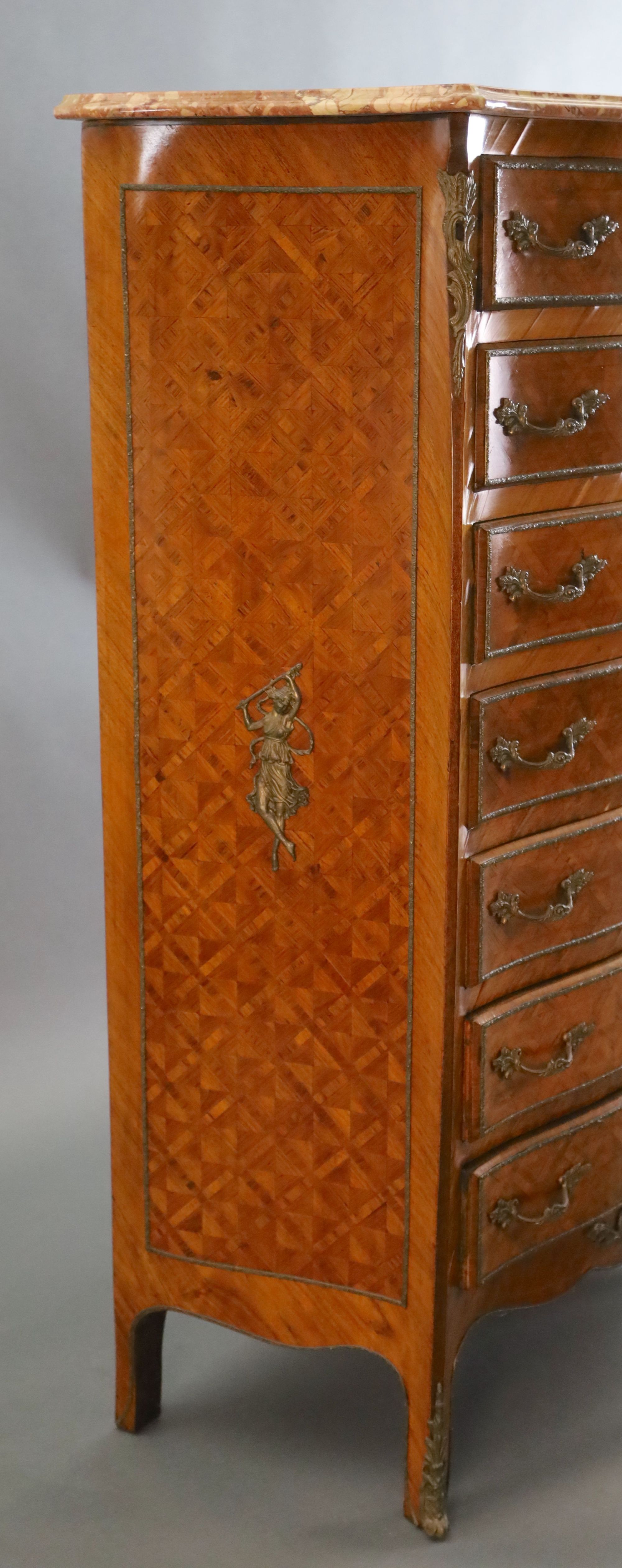 An early 20th century French Louis XVI style parquetry semanier,
